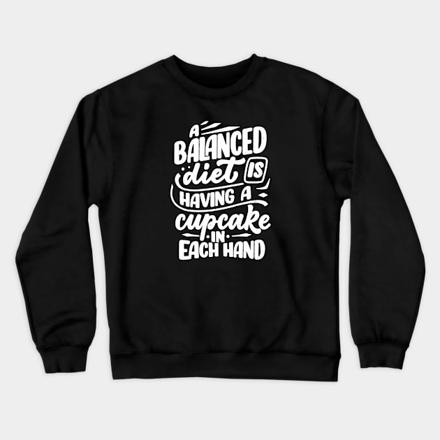 A Balanced Diet is Having a Cupcake in Each Hand Crewneck Sweatshirt by TipsyCurator